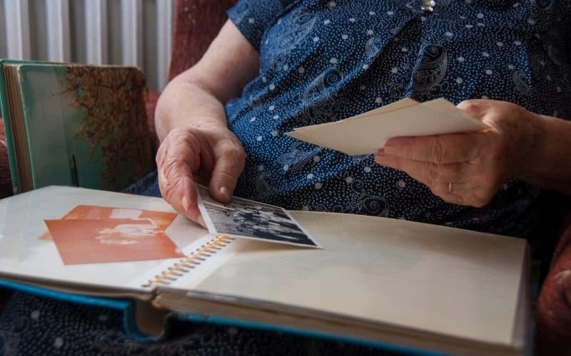 Photo of a pair of hands holding some pictures