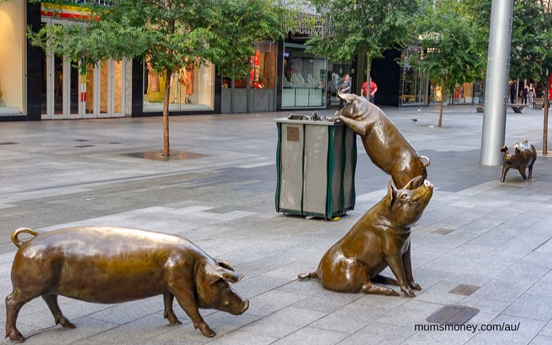 Pig statues in an urban walking mall