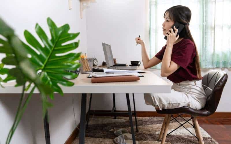 A VA holding a phone