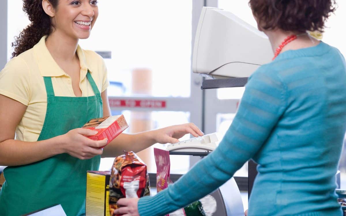 Photo showing a woman talking to another woman