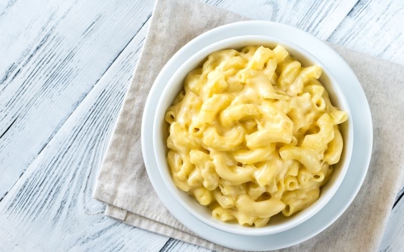 Photo of macaroni and cheese in a white bowl