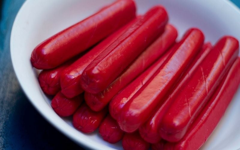 Photo of hotdogs in a white bowl