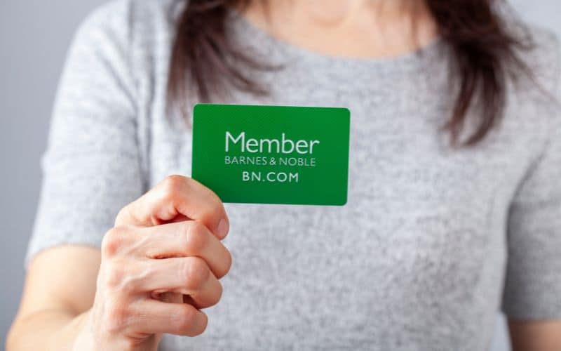 Woman holding membership card