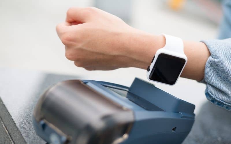 Image showing a hand wearing a smart watch over a scanner