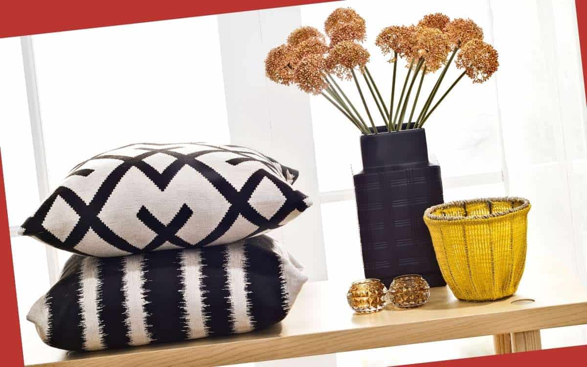 aimsge showing throw pillows and a vase on a table