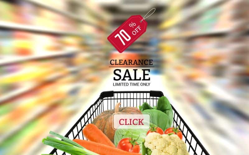 A grocery cart with text overlay showing clearance sale with blurred backgrounds.