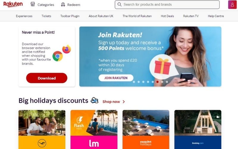 Image of Rakuten cashback app website with image of a woman holding a mobile phone in blue background.