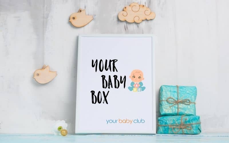 three gift boxes with one big white box with label Your Baby Box on it