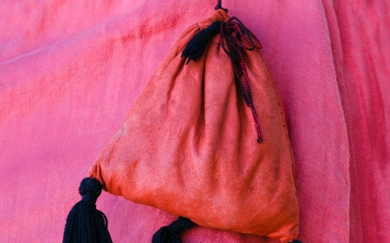 Photo of a red pouch over a pink cloth